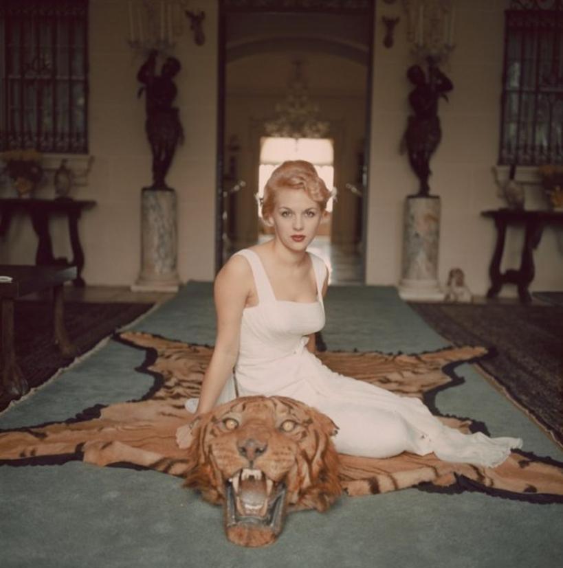 George Cameron 
1959
by Slim Aarons

Slim Aarons Limited Estate Edition

Mrs. George (Daphne) Cameron sits on a tiger pelt in the trophy room of Laddie Sanford’s Palm Beach house.

unframed
c type print
printed 2023
20 x 20"  - paper size


Limited