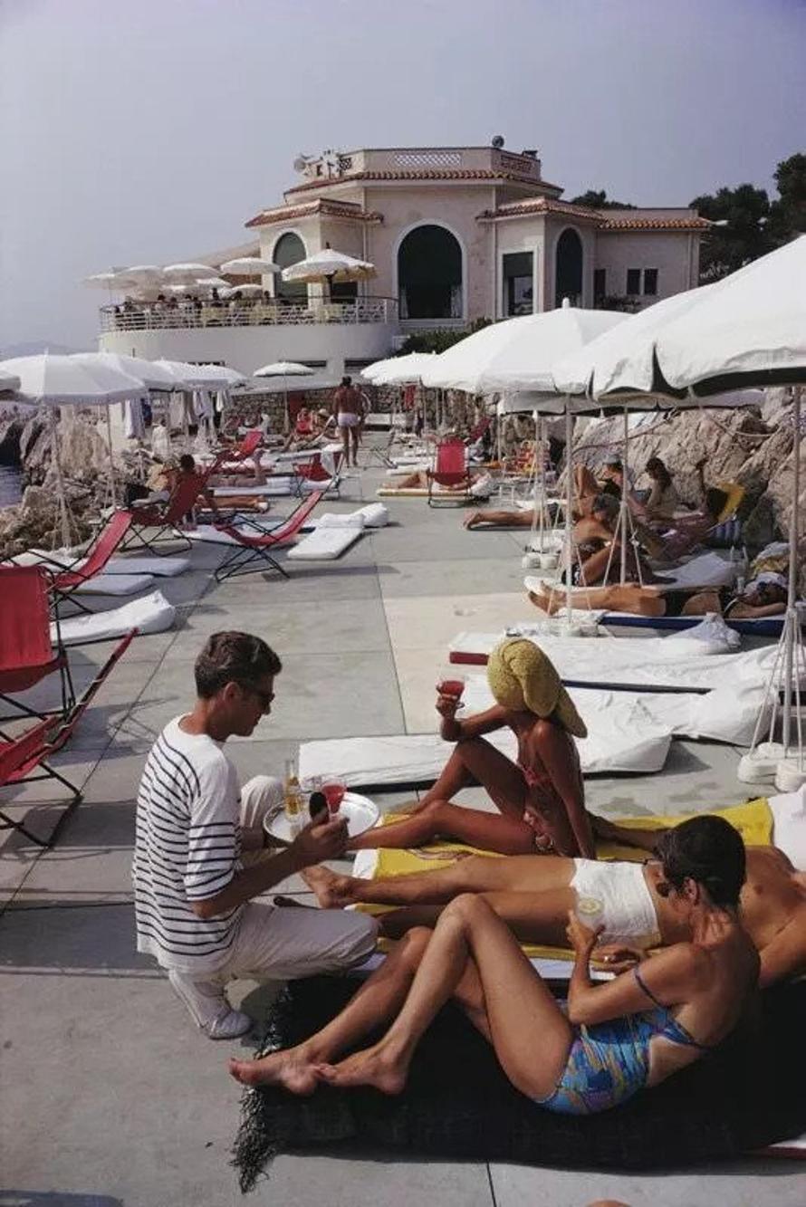 Hotel du Cap 
1969
by Slim Aarons

Slim Aarons Limited Estate Edition

Holidaymakers at the Hotel du Cap Eden-Roc, Antibes on the French Riviera, 1969.

unframed
c type print
printed 2023
20 × 16 inches - paper size


Limited to 150 prints only –