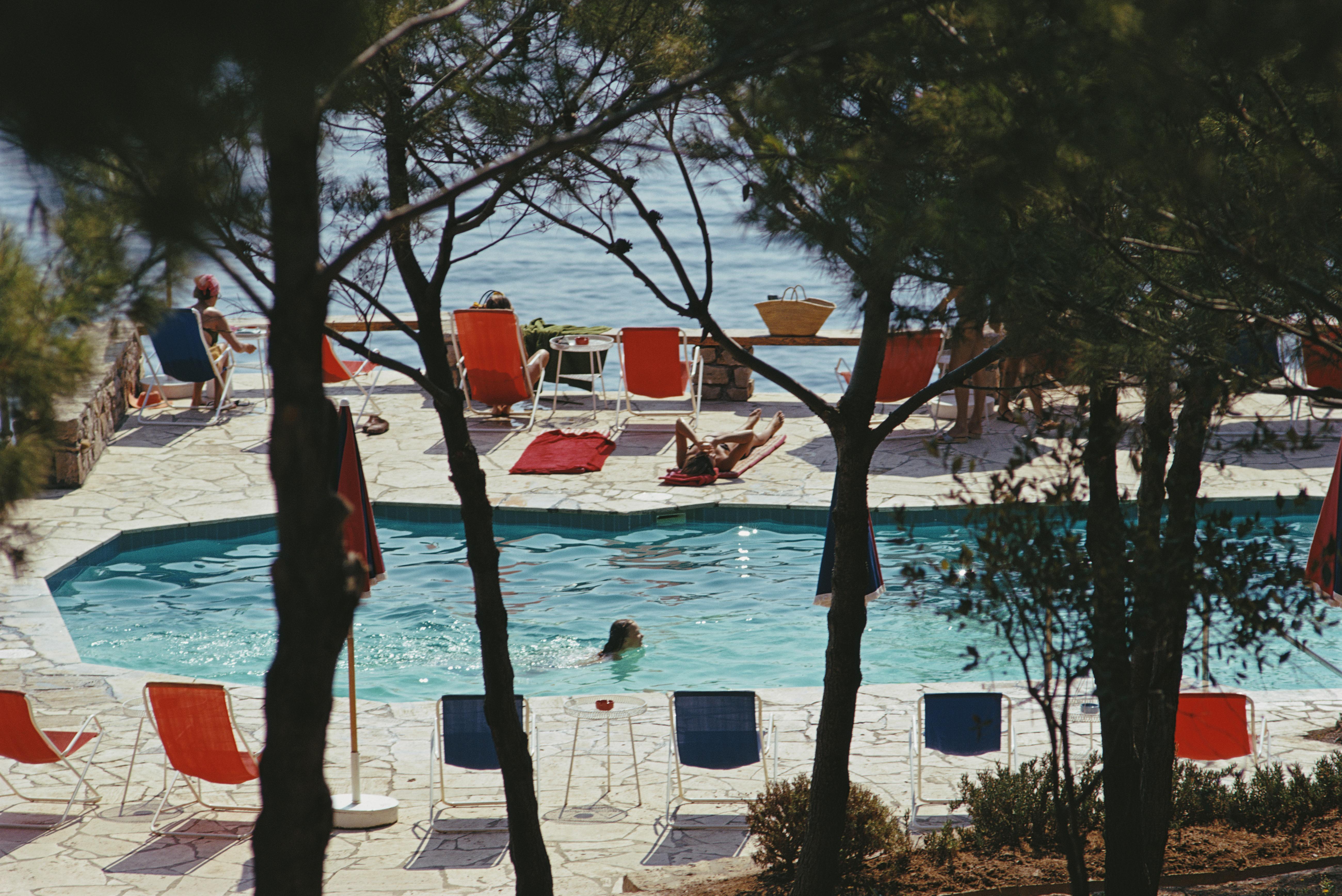 'Hotel Il Pellicano' 1973 Slim Aarons Limited Estate Edition Print 

The beachside pool at the Hotel Il Pellicano in Porto Ercole, Tuscany, August 1973. 

Produced from the original transparency
Certificate of authenticity supplied 
Archive