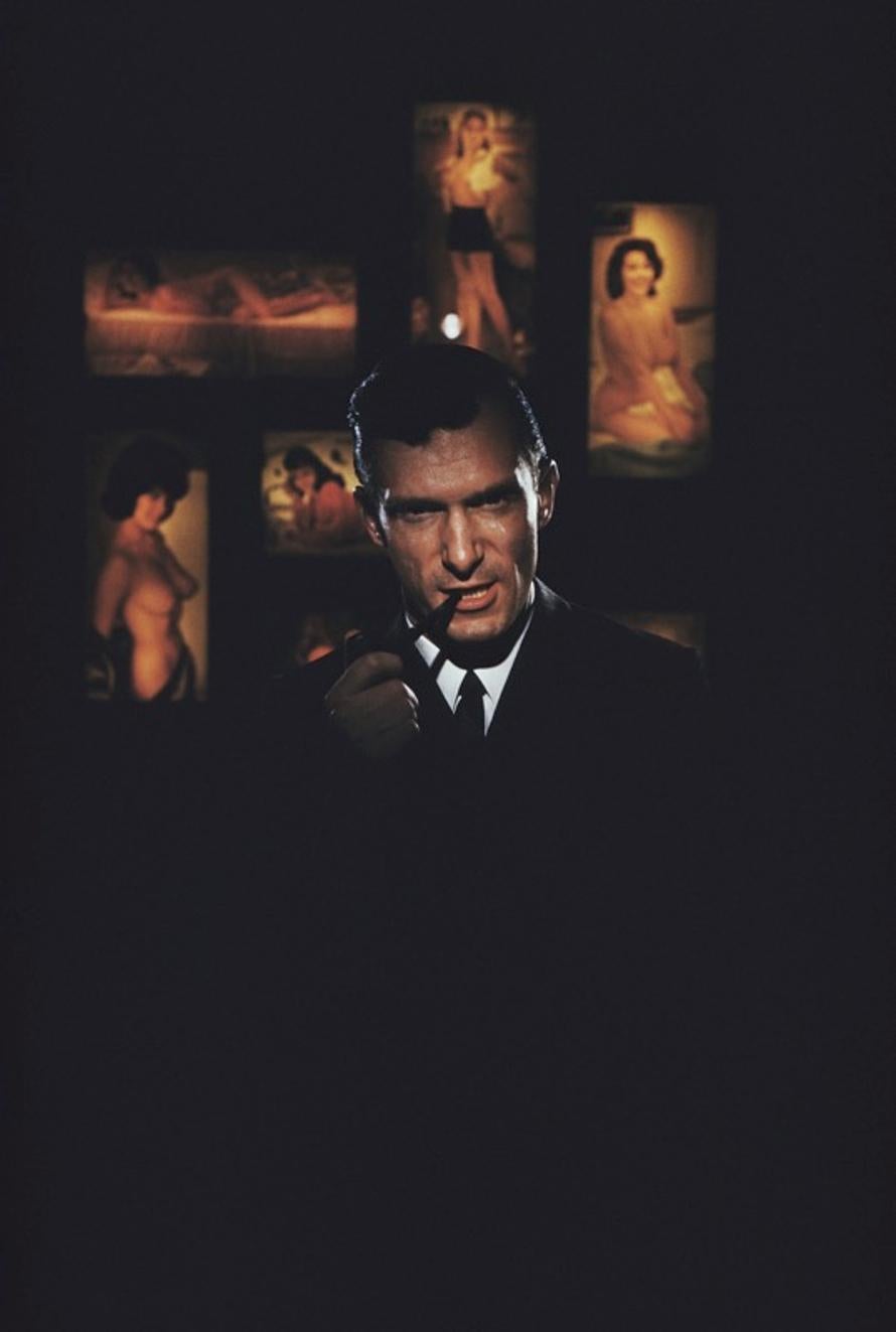 Hugh Hefner 
1961
by Slim Aarons

Slim Aarons Limited Estate Edition

American publisher Hugh Hefner, founder of ‘Playboy’ magazine, surrounded by erotica at the Playboy Club in Chicago, 1961.

unframed
c type print
printed 2023
24 x 20"  - paper