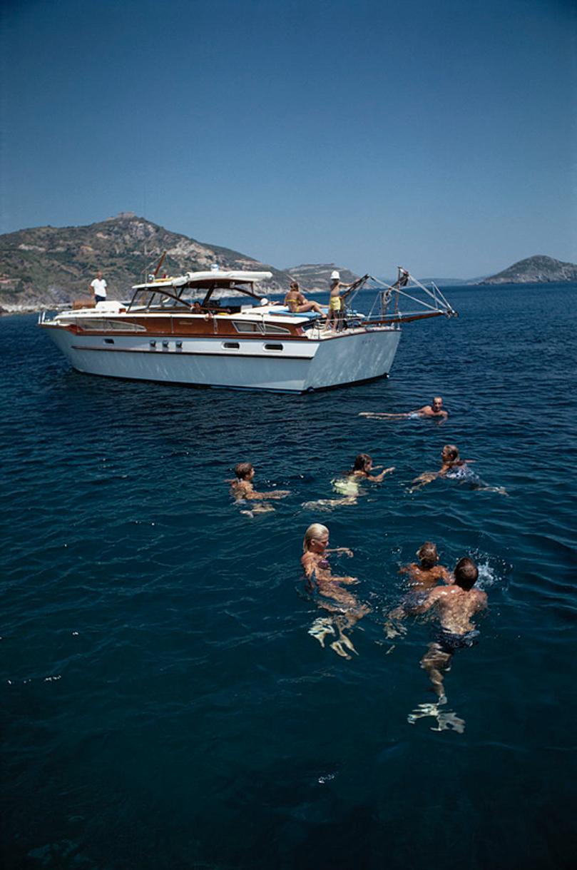 Italian Holiday 
1969
by Slim Aarons

Slim Aarons Limited Estate Edition

Emilio Pucci, Marchese di Barsento, holidays with family and friends on a luxury yacht in Porto Ercole, Tuscany, August 1969. 

unframed
c type print
printed 2023
20 × 16