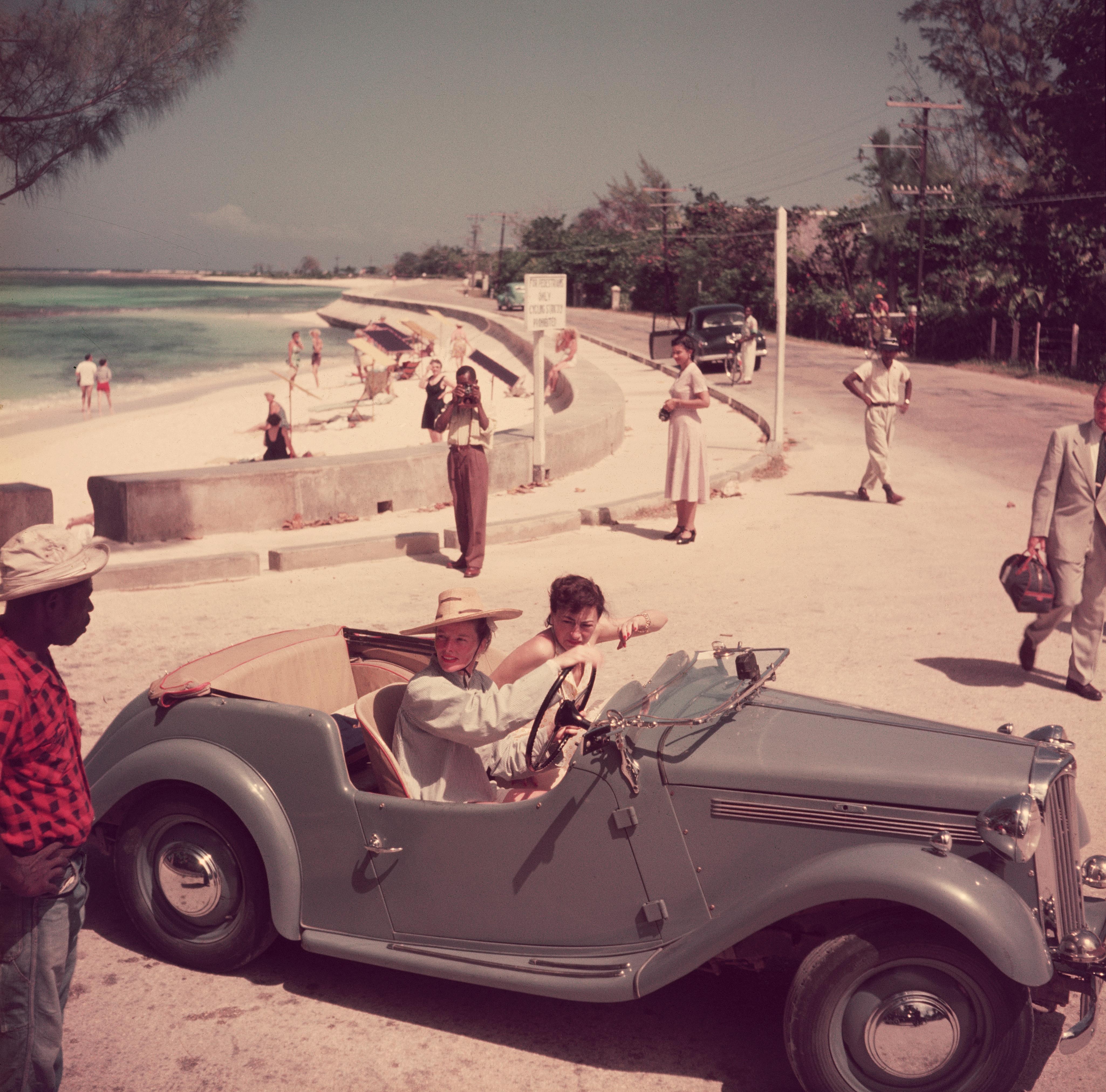 'Katharine Hepburn' 1953 Slim Aarons Limited Estate Edition

1953: American film star Katharine Hepburn (1907 – 2003) driving along the waterfront with Irene Mayer Selznick at Montego Bay, Jamaica. (Photo by Slim Aarons)

C Print
Produced from the