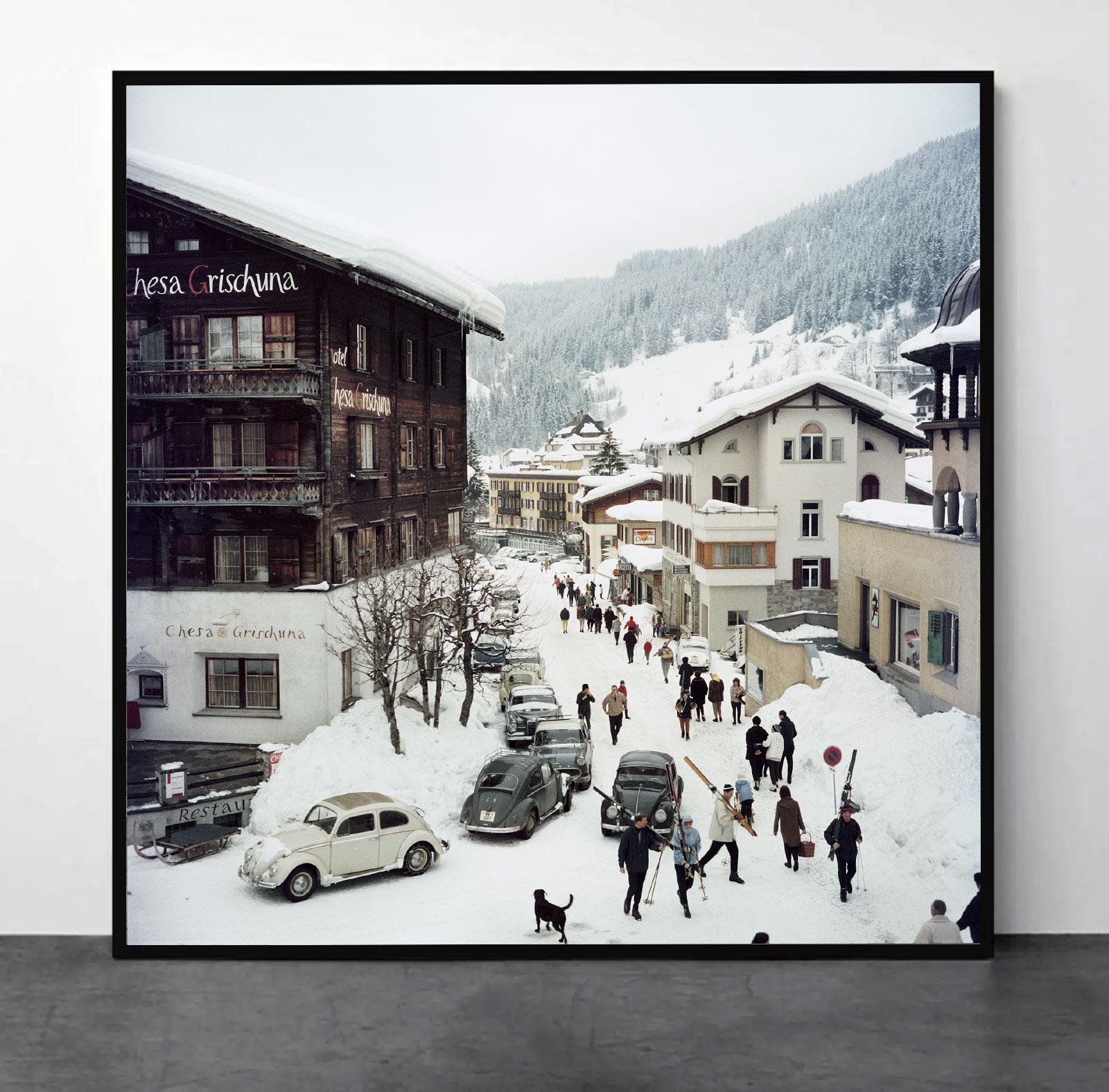 Slim Aarons
Kloisters
1963 (printed later)
C print
Estate stamped and numbered edition of 150 
with Certificate of authenticity
Caption: Skiers pass by the Hotel Chesa Grischuna in Klosters, 1963. (Photo by Slim Aarons/Hulton Archive/Getty