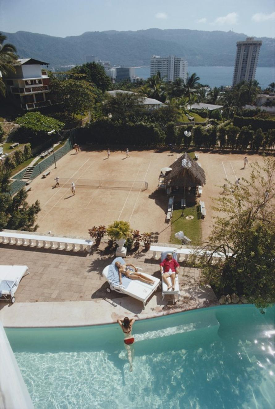 La Barranca 
1971
by Slim Aarons

Slim Aarons Limited Estate Edition

Bandleader Teddy Stauffer (1909 – 1991) at La Barranca, Warren Avis’ villa in Acapulco, January 1971.

unframed
c type print
printed 2023
20 × 16 inches - paper size


Limited to