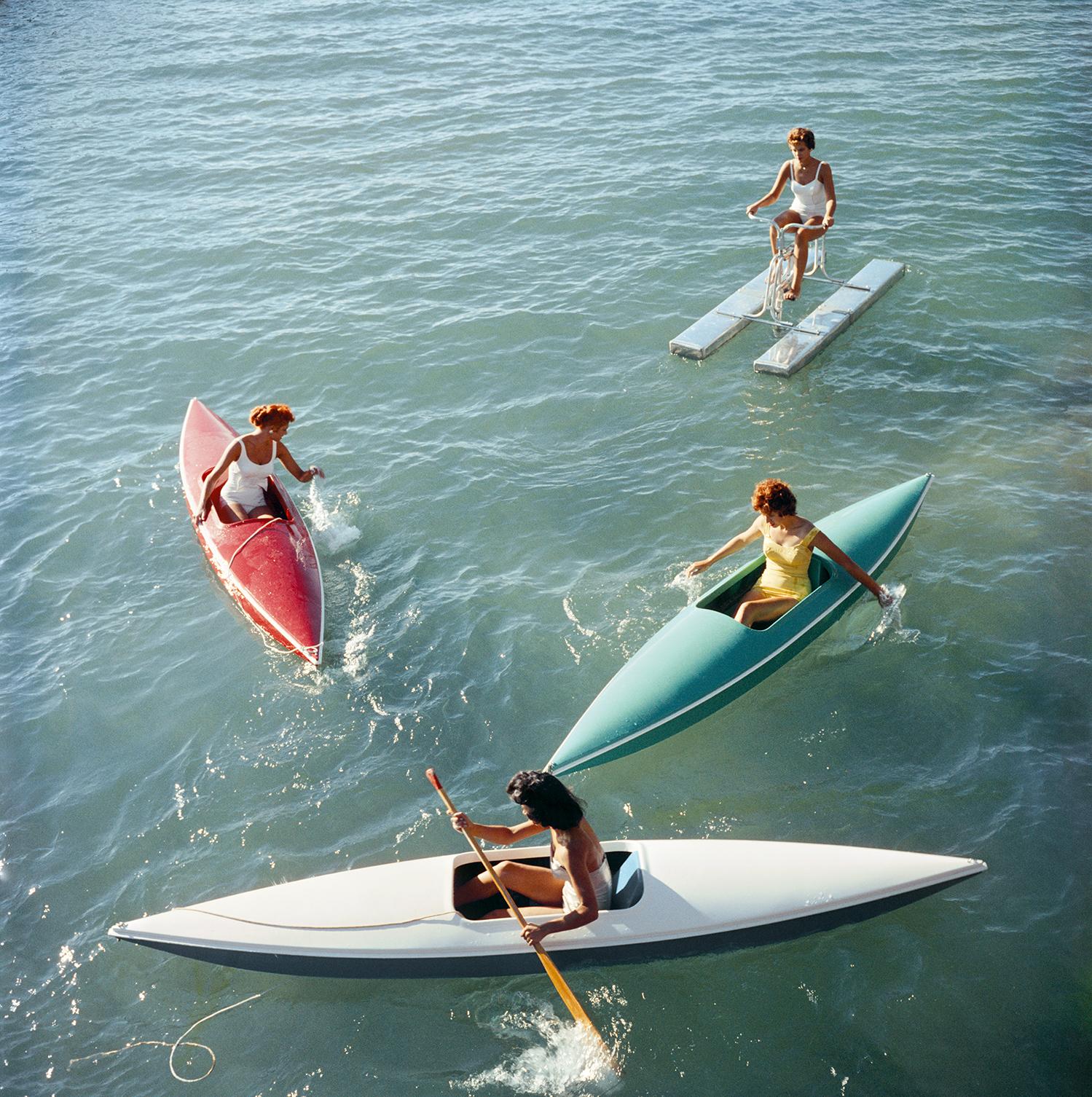 Slim Aarons
Lake Tahoe Trip
1959
C print
Estate stamped and hand numbered edition of 150 with certificate of authenticity from the estate. 

Young women canoeing at Zephyr Cove on the Nevada side of Lake Tahoe, USA, 1959. (Photo by Slim