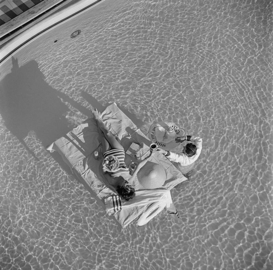 Las Vegas Luxury 
1954
by Slim Aarons

Slim Aarons Limited Estate Edition

Austrian actress Mara Lane enjoys waiter service in the pool at the Sands Hotel, Las Vegas, 1954. 

unframed
Silver gelatin print
printed 2023
16 × 16″ - paper size


Limited