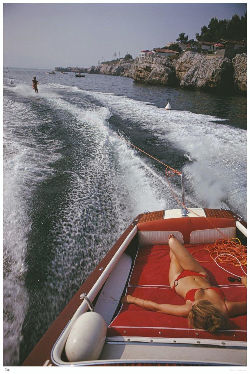 Leisure In Antibes

1969

A woman sunbathing in a motorboat as it tows a waterskiier, in the sea off the Hotel du Cap-Eden-Roc in Antibes on the French Riviera, August 1969.

By Slim Aarons

60x40” / 101x152 cm - paper size 
C-Type Print
unframed