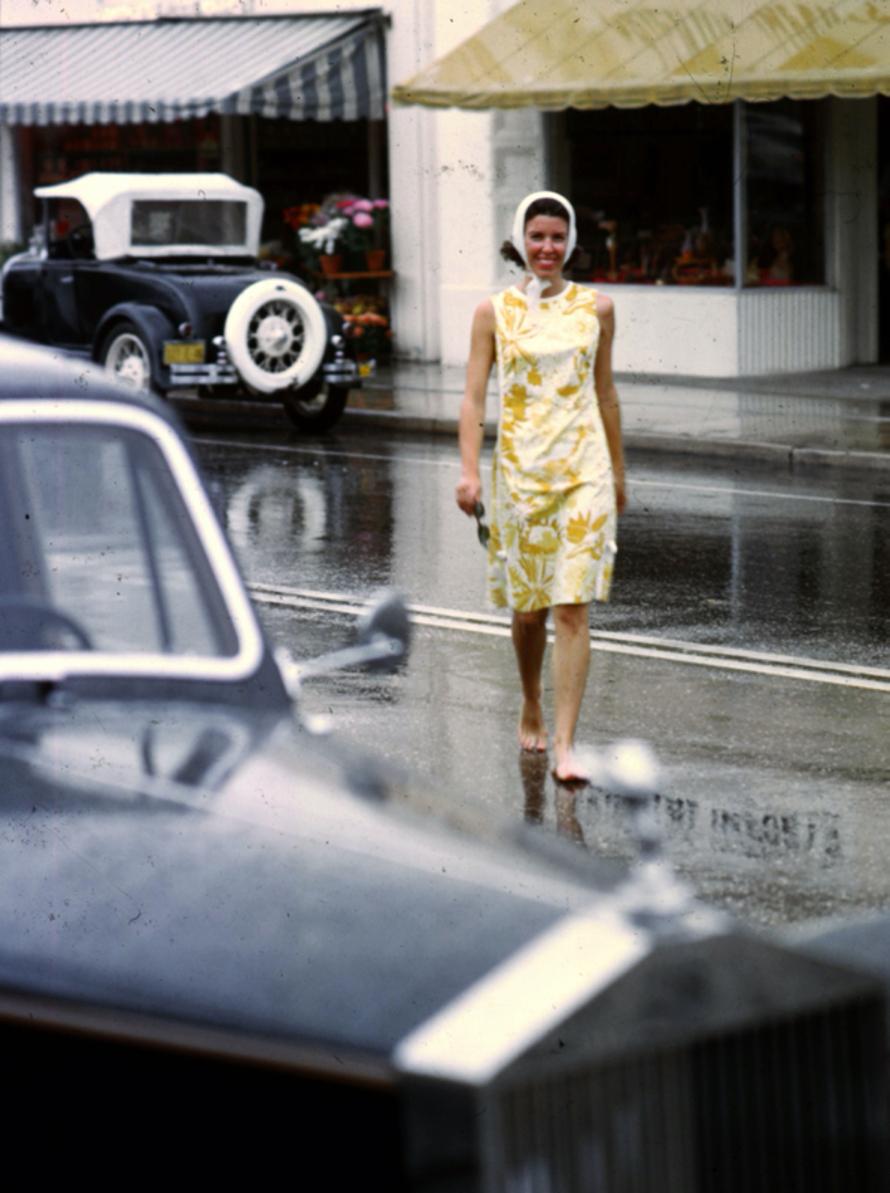 Look No Shoes 
1964
by Slim Aarons

Slim Aarons Limited Estate Edition

Mrs A Atwater Kent Jnr dressed in a simple shift dress is crossing the road barefoot in the rain. 

unframed
c type print
printed 2023
20 × 16 inches - paper size


Limited to
