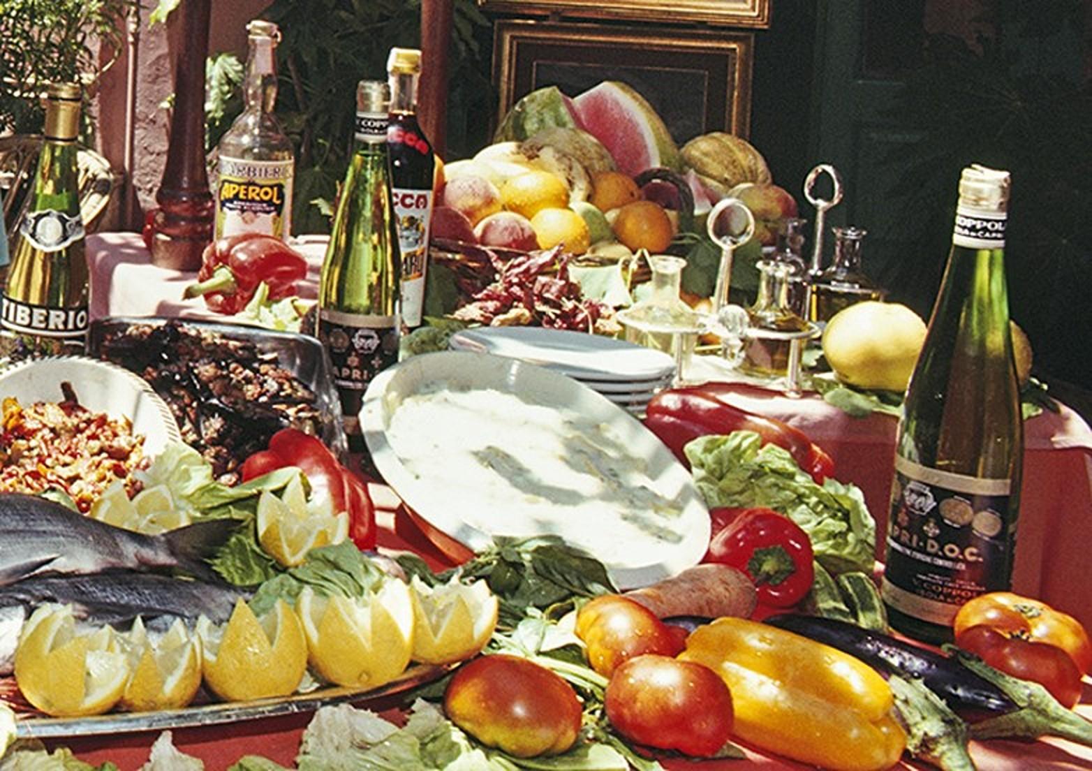 Lunch at La Pigna, 1980 - Lemon Trees at Iconic Italian Ristorante on Capri - Black Landscape Photograph by Slim Aarons