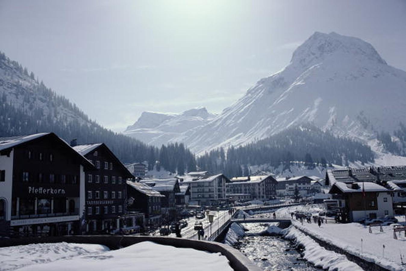 Slim Aarons Color Photograph - Main Street Lech - Snowy Mountains and Outdoors Winter Nature Scenery