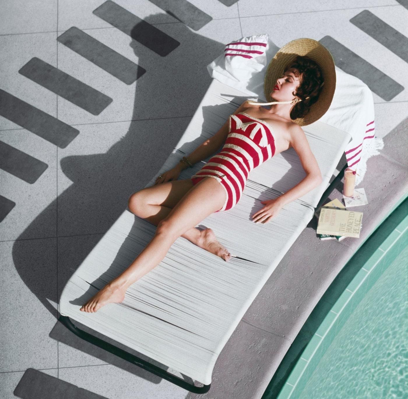 Mara Lane At The Sands

 1954

Austrian actress Mara Lane lounging by the pool in a red and white striped bathing costume at the Sands Hotel, Las Vegas, 1954. 

40x40” / 101 x 101 cm - paper size 
Archival pigment print
unframed 
(framing available