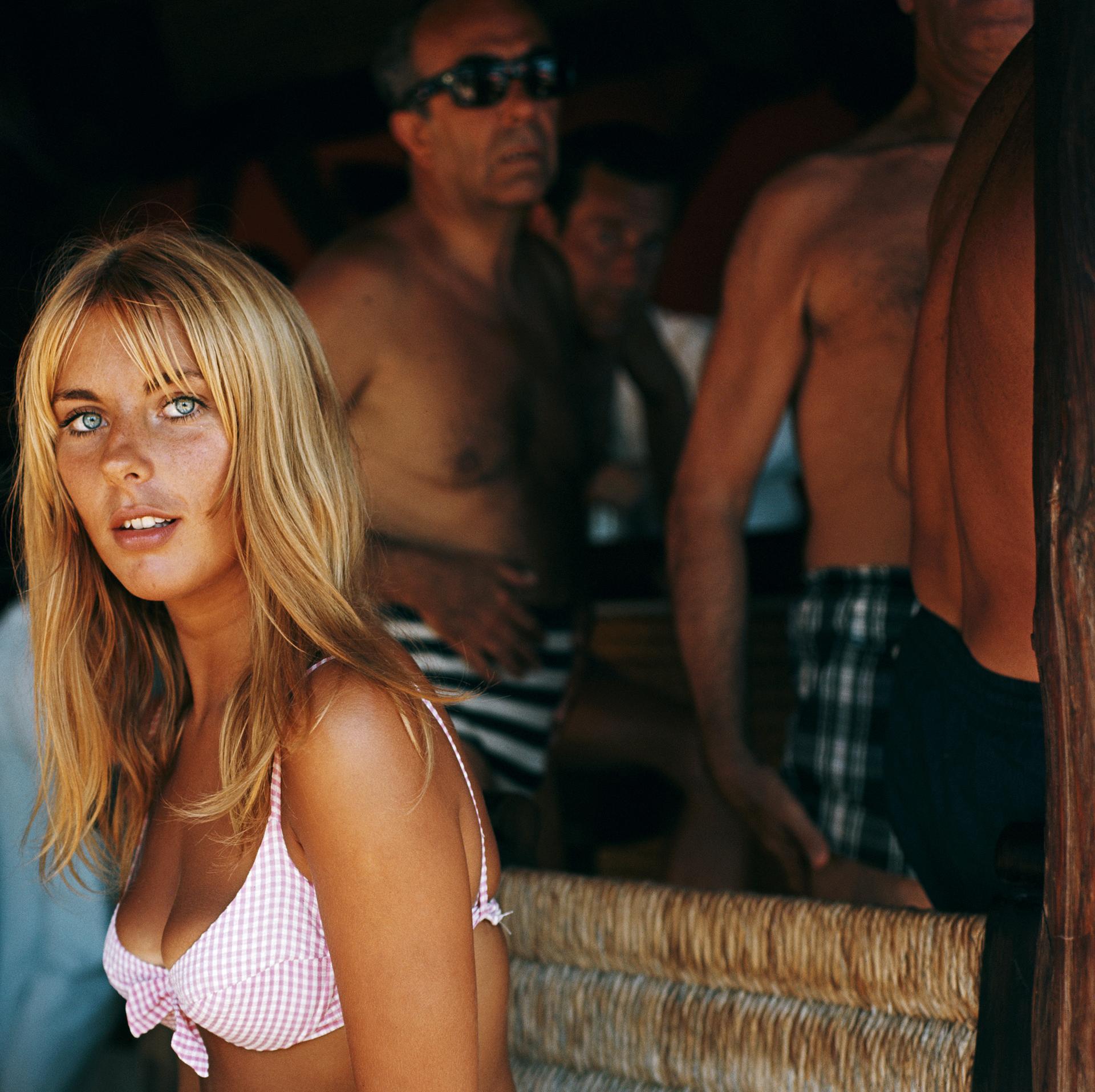 This mid-1970s portrait photograph, captured by society photographer Slim Aarons, features a guest taking a break from the sun at the Marbella Club, Marbella, Spain.

This is an estate stamped and hand numbered edition of 150 with certificate of
