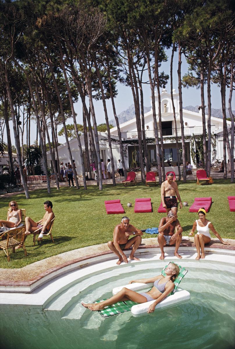 Marbella House Party

Guests at a party at the home of Sebastiano Bergese in Marbella, Spain, August 1967.

60x40” / 101x152 cm - paper size 

Estate Stamped Collection Edition to 150 

Photo by Slim Aarons

Printed in 2025

Limited to 150 prints
