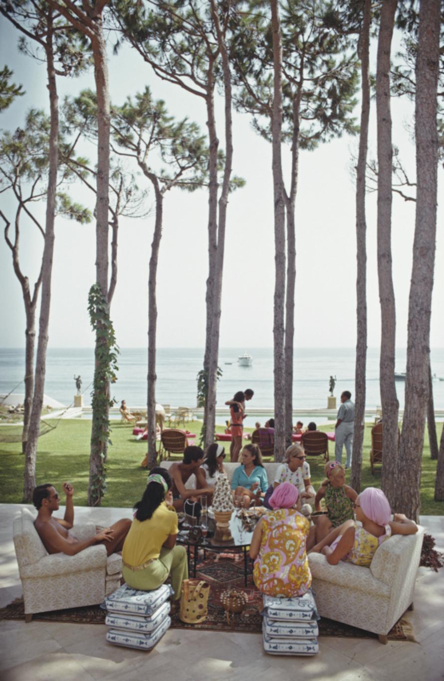 Marbella House Party 
1967
by Slim Aarons

Slim Aarons Limited Estate Edition

Guests at a party at the home of Sebastiano Bergese in Marbella, Spain, 1967.

unframed
c type print
printed 2023
24 x 20"  - paper size

Limited to 150 prints only –