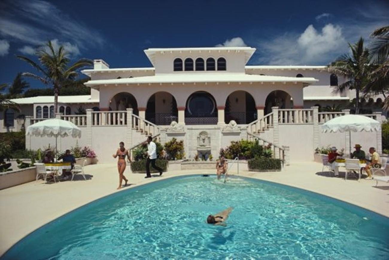 McMartin Villa 
1977
by Slim Aarons

Slim Aarons Limited Estate Edition

Guests around the pool at Elephant Walk, Duncan McMartin’s villa in Bermuda, September 1977.

unframed
c type print
printed 2023
20 x 24"  - paper size

Limited to 150 prints