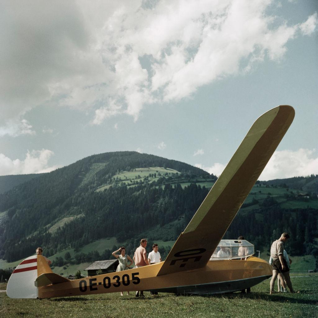 This late 1950s landscape photograph, captured by society photographer Slim Aarons, features a glider resting on the ground by Mittersill Castle, Austria.

This is an estate stamped and hand numbered edition of 150 with certificate of authenticity