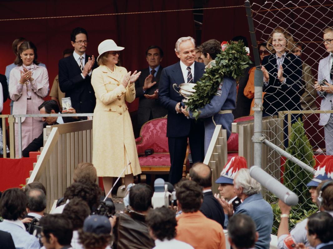 'Monaco Grand Prix' 

Left to right: princesses Stephanie, Caroline and Grace (1929 - 1982) of Monaco applaud as Prince Rainier III (1923 - 2005) presents a trophy to South African racing driver Jody Scheckter after his victory in the Monaco Grand