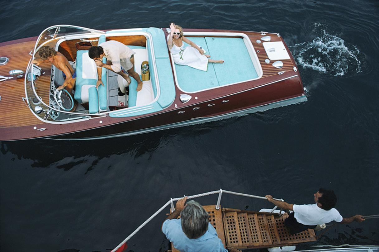 Monte Carlo 
1975
by Slim Aarons

Slim Aarons Limited Estate Edition

Friends board a riva boat in Monte Carlo, Monaco, 1975. 

unframed
c type print
printed 2023
20 x 24"  - paper size

Limited to 150 prints only – regardless of paper size

blind