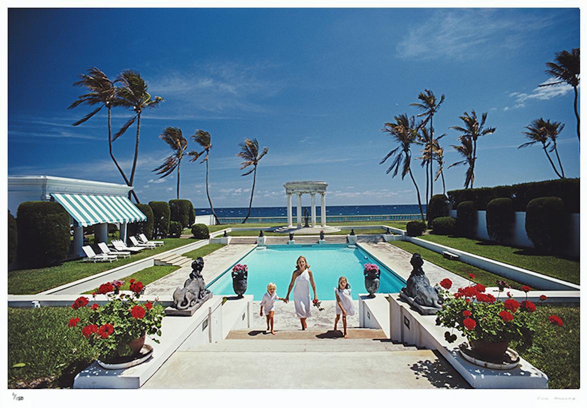 Neo-Classical Pool 1985 - Slim Aarons Estate Stamped

Mrs T. Dennie Boardman and her children Samuel Jay and Sarah climbing the steps from the pool at the home of Boardman’s parents in Palm Beach, Florida, 1985.

20 x 30" inches / 51 x 76 cm paper