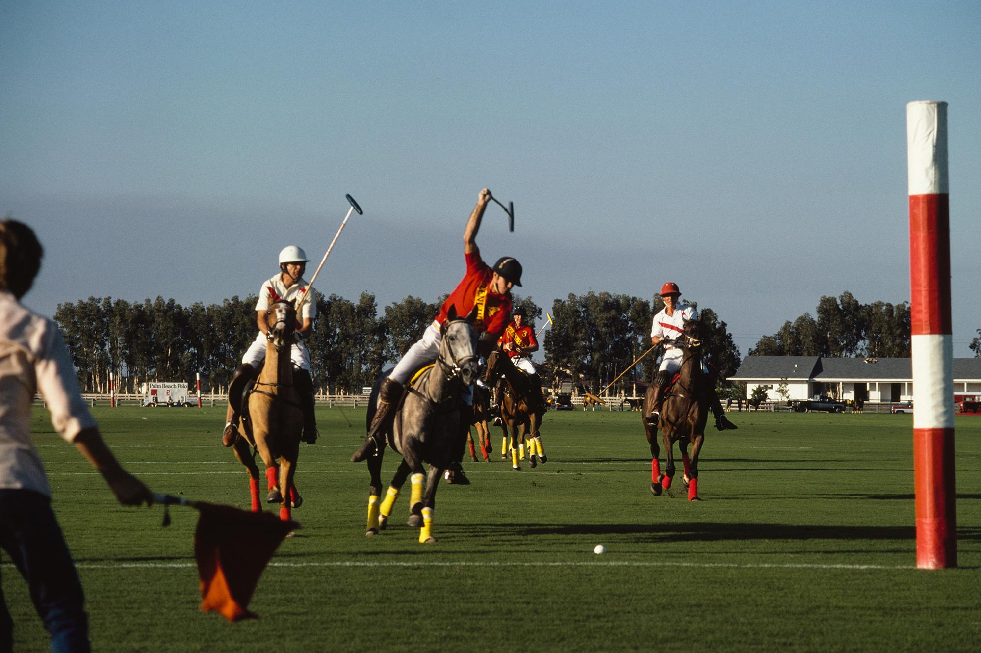 A player raises his mallet ready to strike the ball during a polo match at the Palm Beach Polo Club, Florida, 1982. 

Slim Aarons
Palm Beach Polo Match
1964
C-Print
Estate signature stamped and hand numbered edition of 150 with certificate of