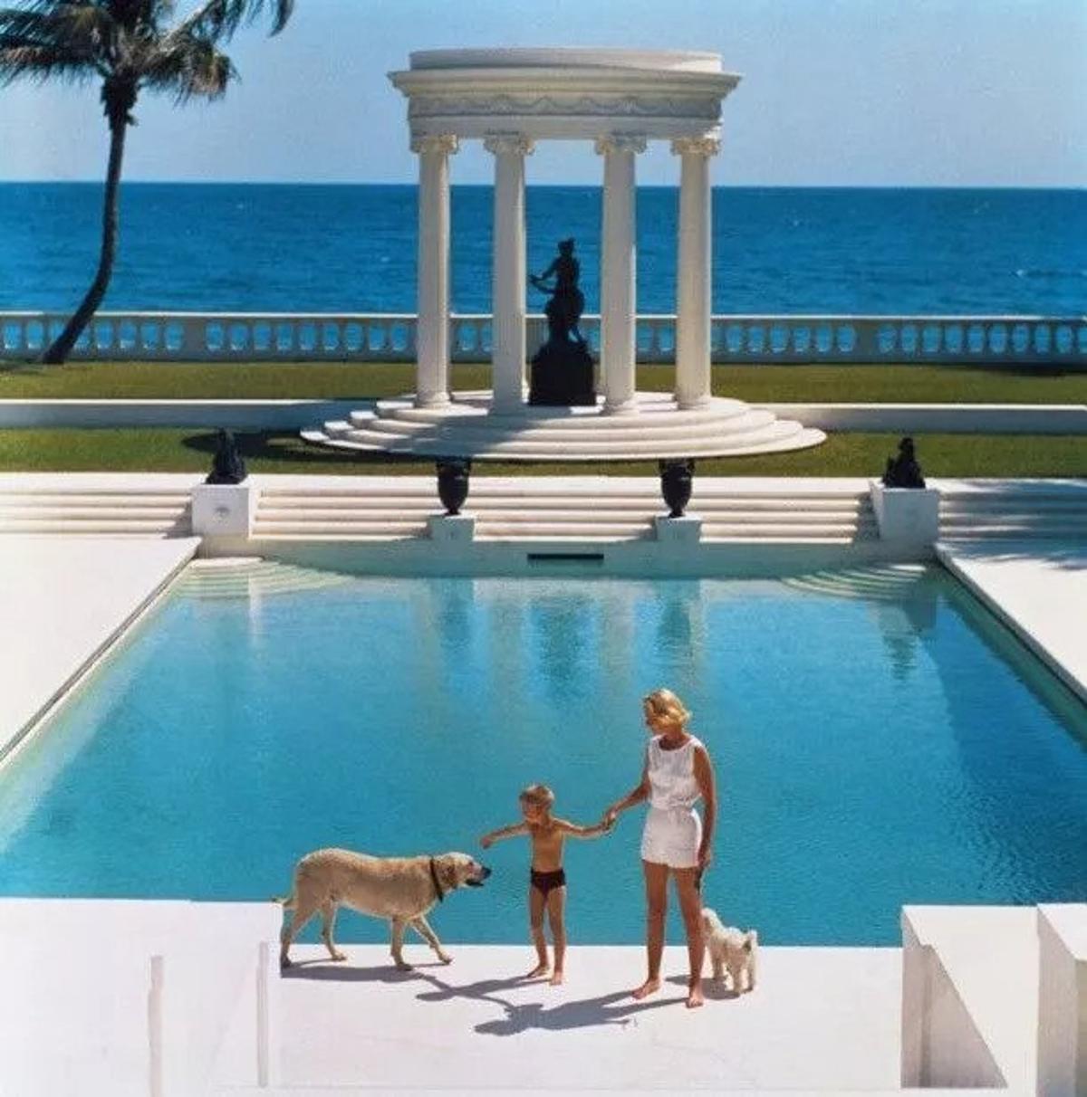 Nice Pool 
1955
by Slim Aarons

(printed 2023)
Slim Aarons Limited Estate Edition

American writer C.Z. Guest (Mrs F.C. Winston Guest, 1920 – 2003) and her son Alexander Michael Douglas Dudley Guest in front of their Grecian temple pool on the