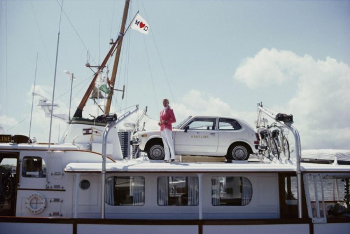 No Transport Problems 
1982
by Slim Aarons

Slim Aarons Limited Estate Edition

Mrs Woolworth Donahue with car and bicycles on her motor yacht, ‘Hartline’. 

unframed
c type print
printed 2023
16 x 20" - paper size

Limited to 150 prints only –