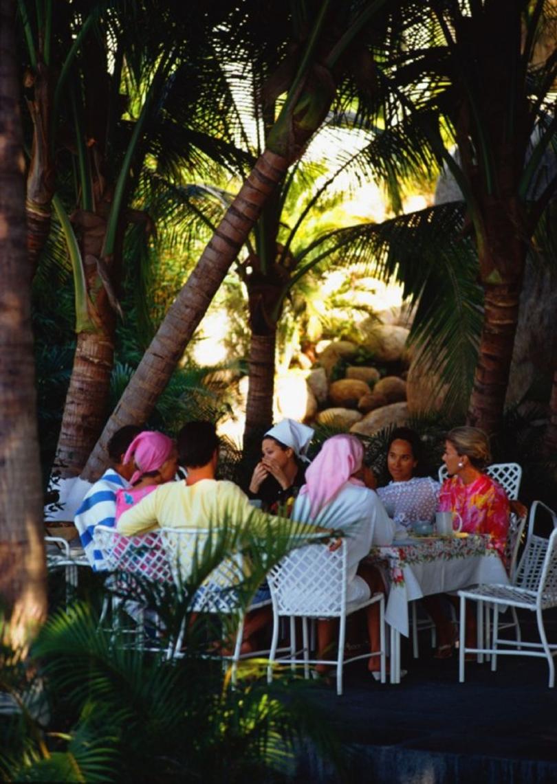 Oberon’s Lunch 
1966
by Slim Aarons

Slim Aarons Limited Estate Edition

 Film star Merle Oberon (1911 – 1979) and lunch guests at her villa, La Consentida, Acapulco. The star is second from the right facing the camera. A Wonderful Time – Slim