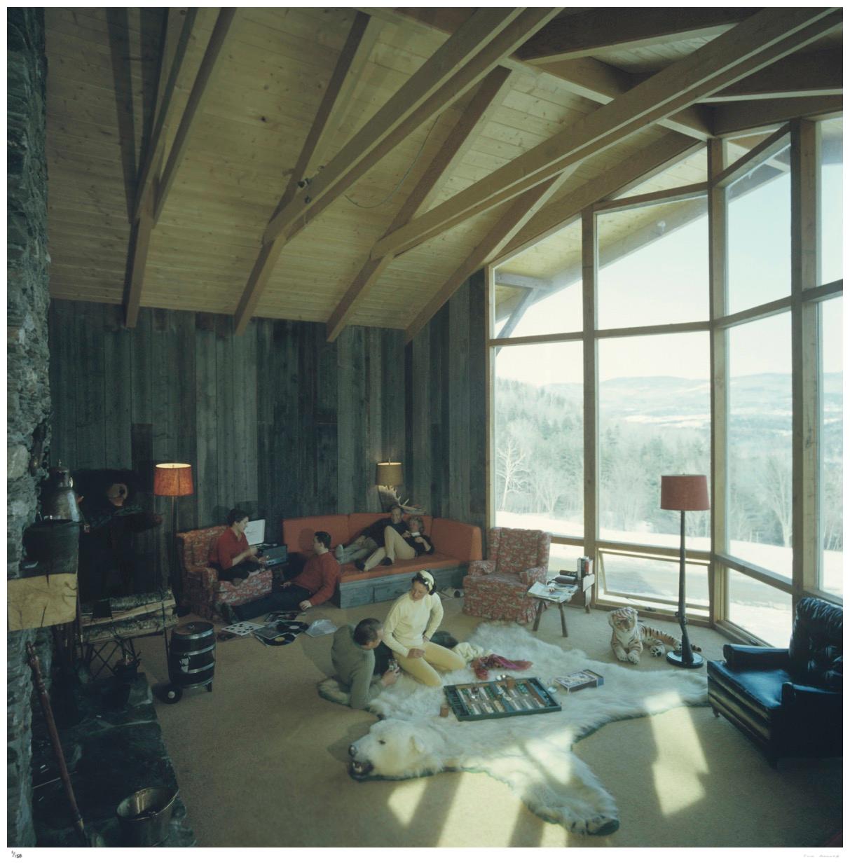 On the Sugarbush Slopes 1960 - Slim Aarons Estate Stamped

A group of people sit relaxing in a chalet on the slopes of the Sugarbush Mountain ski resort, one of the largest ski resorts in New England, in Warren, Vermont, USA, circa 1960. A man and