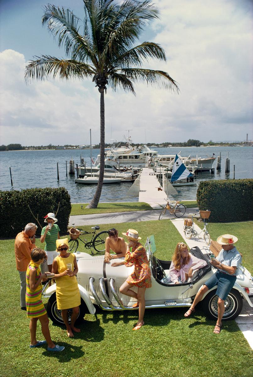 Palm Beach Society

1968

Palm Beach socialite Jim Kimberly (far left) and friends around his white sports car on the shores of Lake Worth, Florida, April 1968. 

By Slim Aarons

30x40” / 76x101 cm - paper size 
C-Type Print
unframed 


Estate