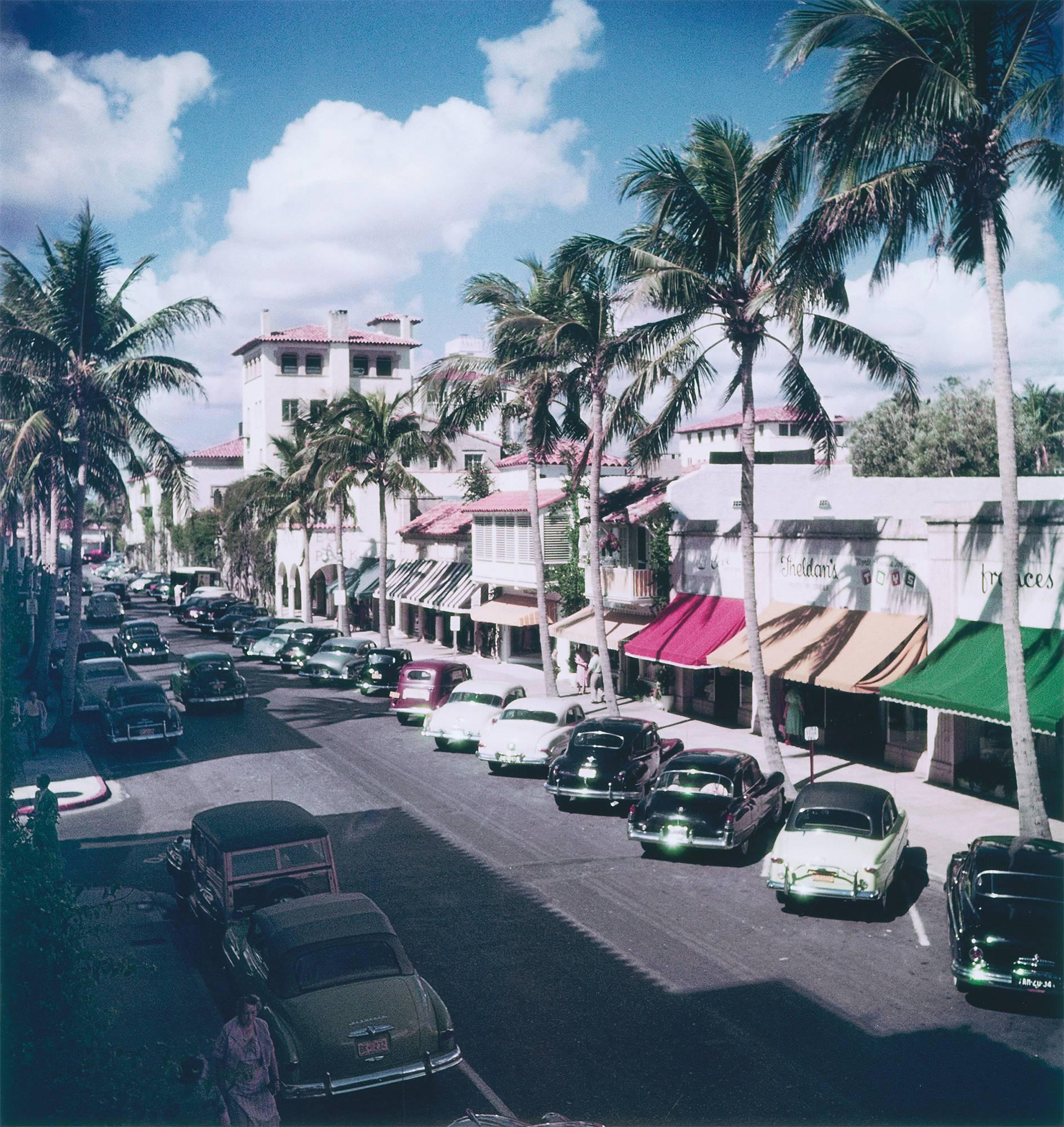 Cars parked on a tree-lined street in Palm Beach, Florida, circa 1953. 
C print
16 x 16 inches
Framed

Estate stamped and hand numbered edition of 150 with certificate of authenticity from the estate.   

Slim Aarons (1916-2006) worked mainly for