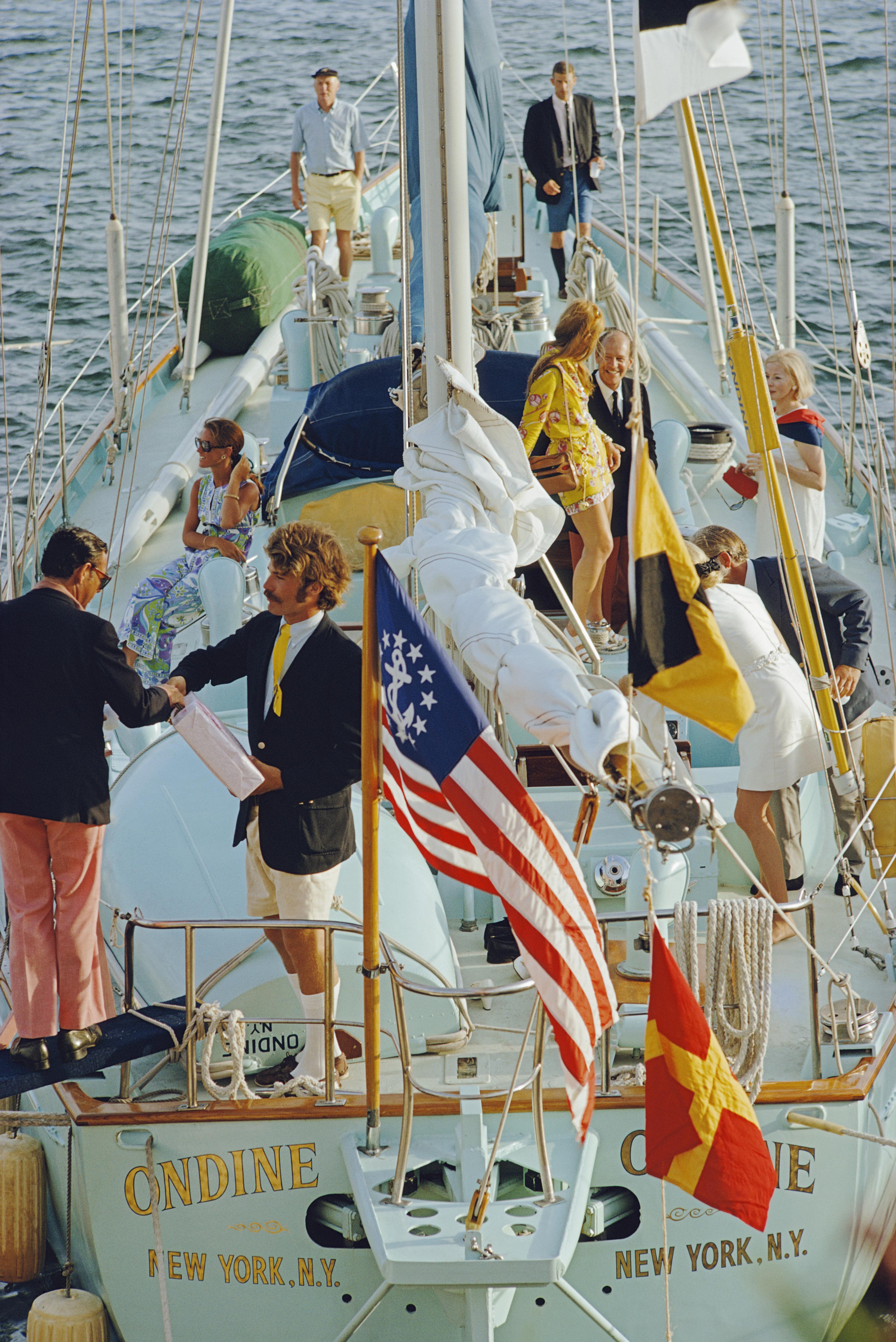 Slim Aarons Portrait Photograph - Party In Bermuda, Estate Edition, (1970 on the Yacht Ondine in yellow and red)