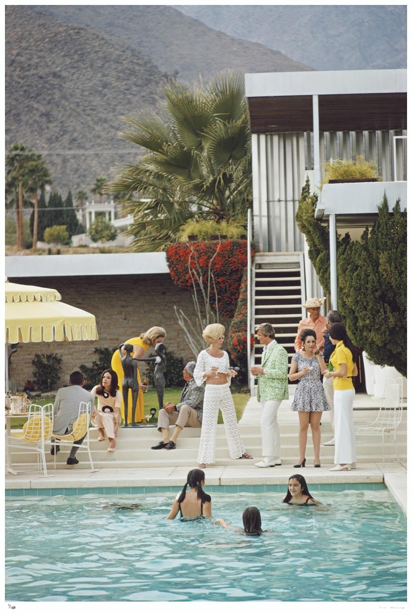 Party on the Steps

1970

Guests by the pool at Nelda Linsk’s desert house in Palm Springs, California, January 1970. The house was designed by Richard Neutra for Edgar J. Kaufmann. Helen Dzo Dzo is seen in the centre wearing a white crochet