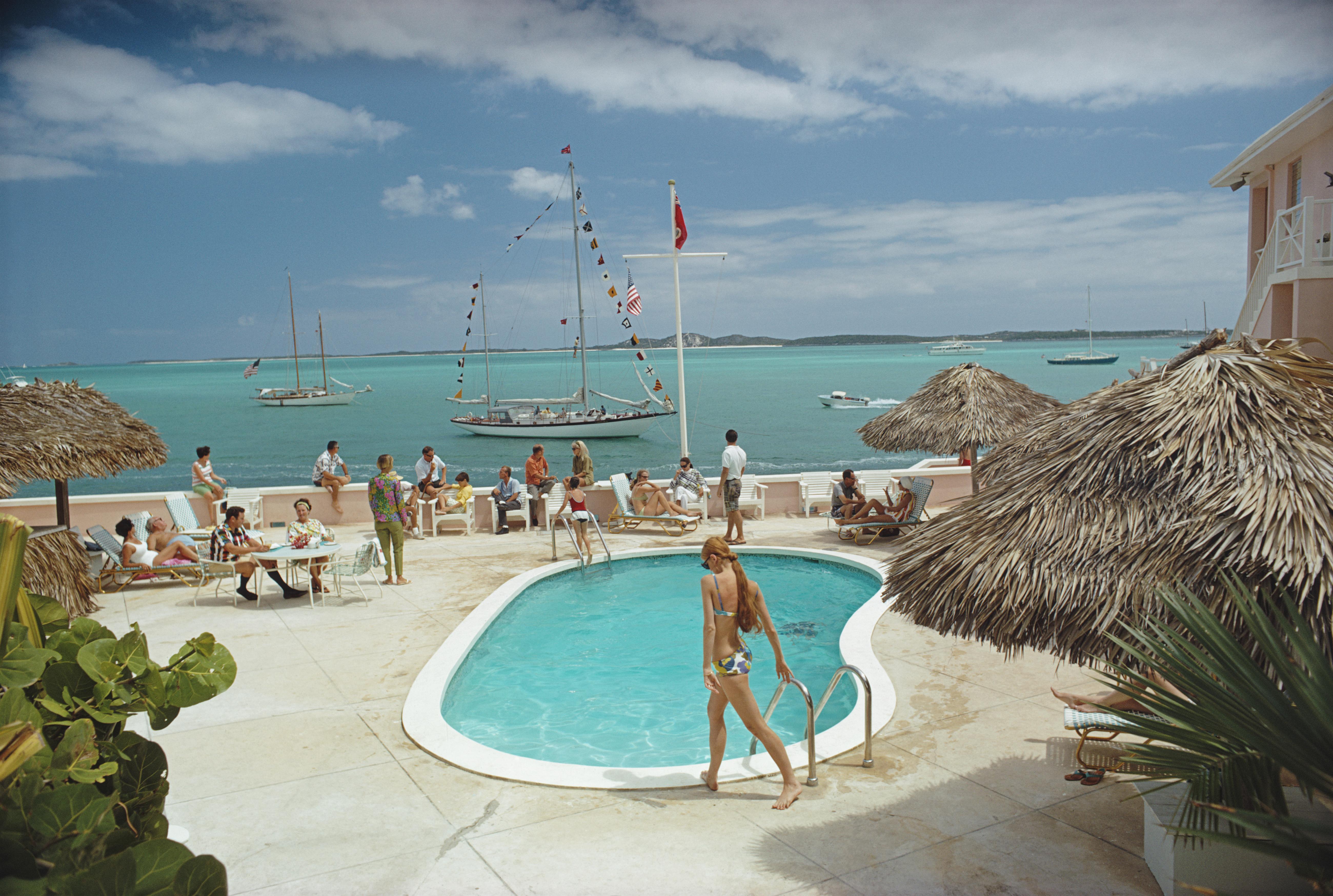 'Peace And Plenty' 1967 Slim Aarons Limited Estate Edition Print 

People by the pool at Club Peace And Plenty, Georgetown on the island of Great Exuma, Bahamas, April 1967. (Photo by Slim Aarons/Hulton Archive/Getty Images)

Produced from the
