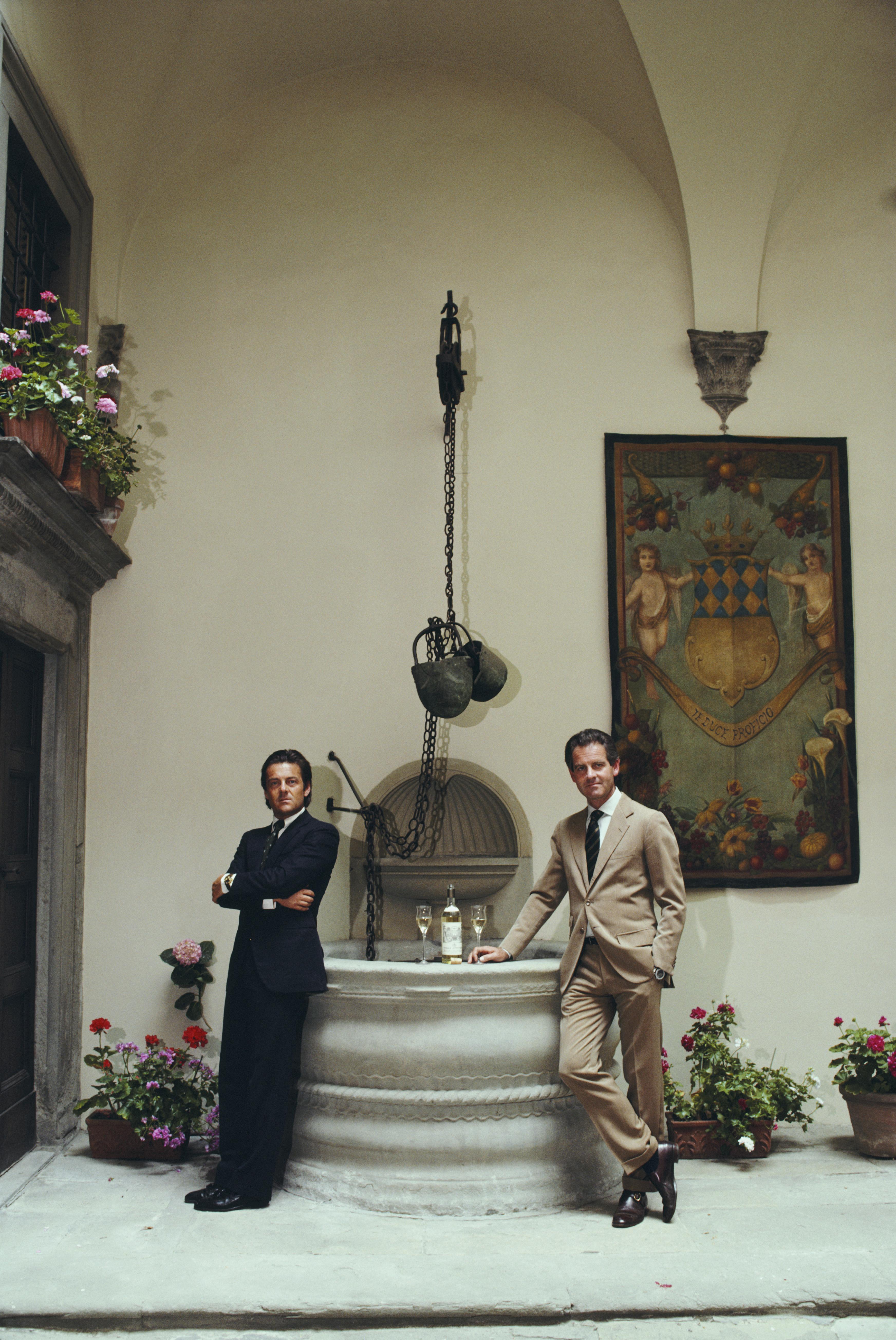 'Pierro And Ludovico Antinori' 1985 Slim Aarons Limited Estate Edition Print 

Pierro Antinori and Ludovico Antinori posing by a well, on which rests a bottle of white wine and two glasses, in Florence, Italy, June 1985. 
(Photo by Slim Aarons/Getty