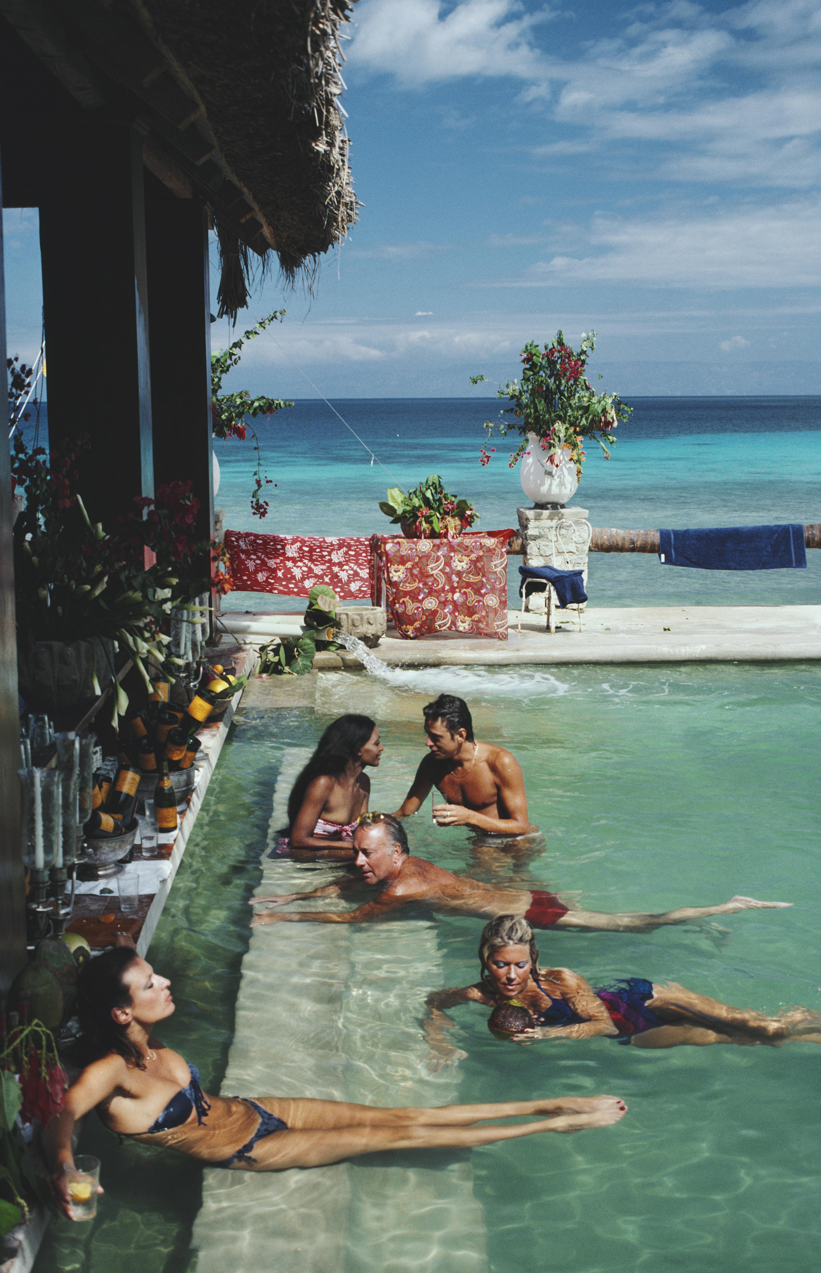 'Plantation Cocoyer' 1981 Slim Aarons Limited Estate Edition Print 

People relaxing in the bar at Plantation Cocoyer, Cocoyer Beach, Haiti, February 1981.

Produced from the original transparency
Certificate of authenticity supplied 
Archive