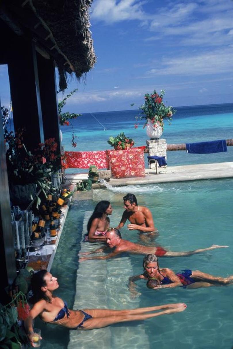 Plantation Cocoyer 
1981
by Slim Aarons

Slim Aarons Limited Estate Edition

People relaxing in the bar at Plantation Cocoyer, Cocoyer Beach, Haiti, February 1981.

unframed
c type
printed 2023
20 x 24"  - paper size

Limited to 150 prints only –