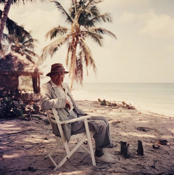 Slim Aarons Figurative Photograph - Poet's Paradise, Estate Edition T.S. Eliot in Love Beach, New Providence Bahamas