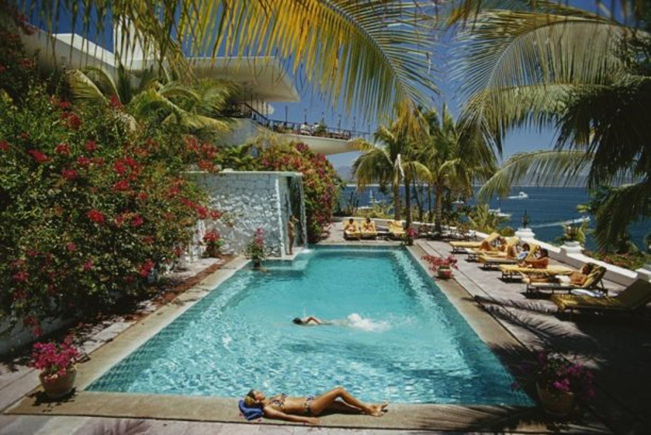 Pool At Las Hadas 
1974
by Slim Aarons

Slim Aarons Limited Estate Edition

Guests round the pool at Las Hadas, Manzanillo, Mexico, 1974

unframed
c type print
printed 2023
16×20 inches - paper size


Limited to 150 prints only – regardless of paper