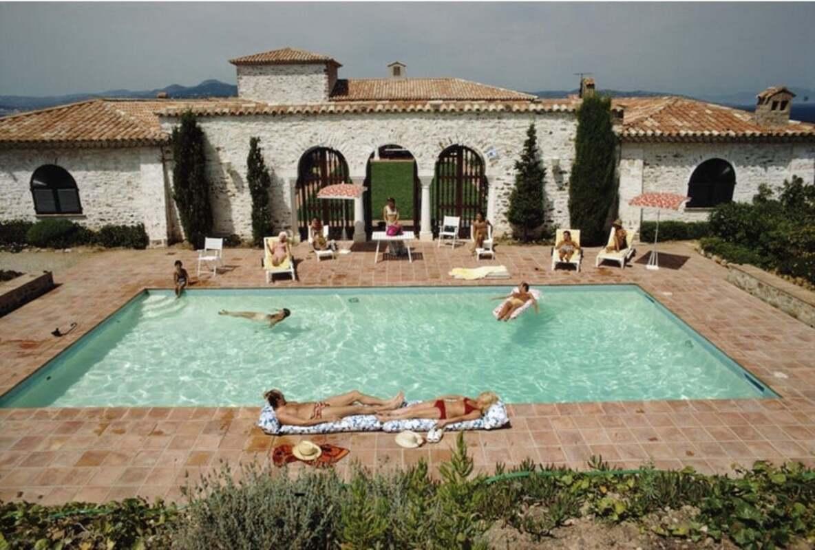 Guests around the pool at a villa in St Tropez, France, circa 1970. (Photo by Slim Aarons/Hulton Archive/Getty Images)

This photograph is from the Estate Limited Edition of 150
30x40”
C-print, from the original transparency
Printed later
With