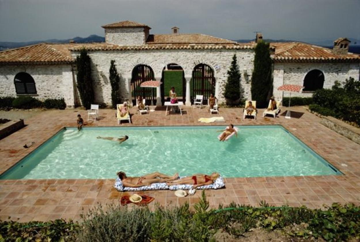 Pool In St Tropez 
1970
by Slim Aarons

Slim Aarons Limited Estate Edition

Guests around the pool at a villa in St Tropez, France, circa 1970

unframed
c type print
printed 2023
20 x 24"  - paper size

Limited to 150 prints only – regardless of