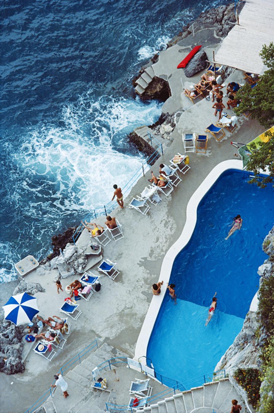 Pool On Amalfi Coast 
1984
by Slim Aarons

Slim Aarons Limited Estate Edition

A view of the seaside pool at the Hotel St. Caterina, Amalfi, Italy, September 1984

unframed
c type print
printed 2023
20 × 16 inches - paper size


Limited to 150
