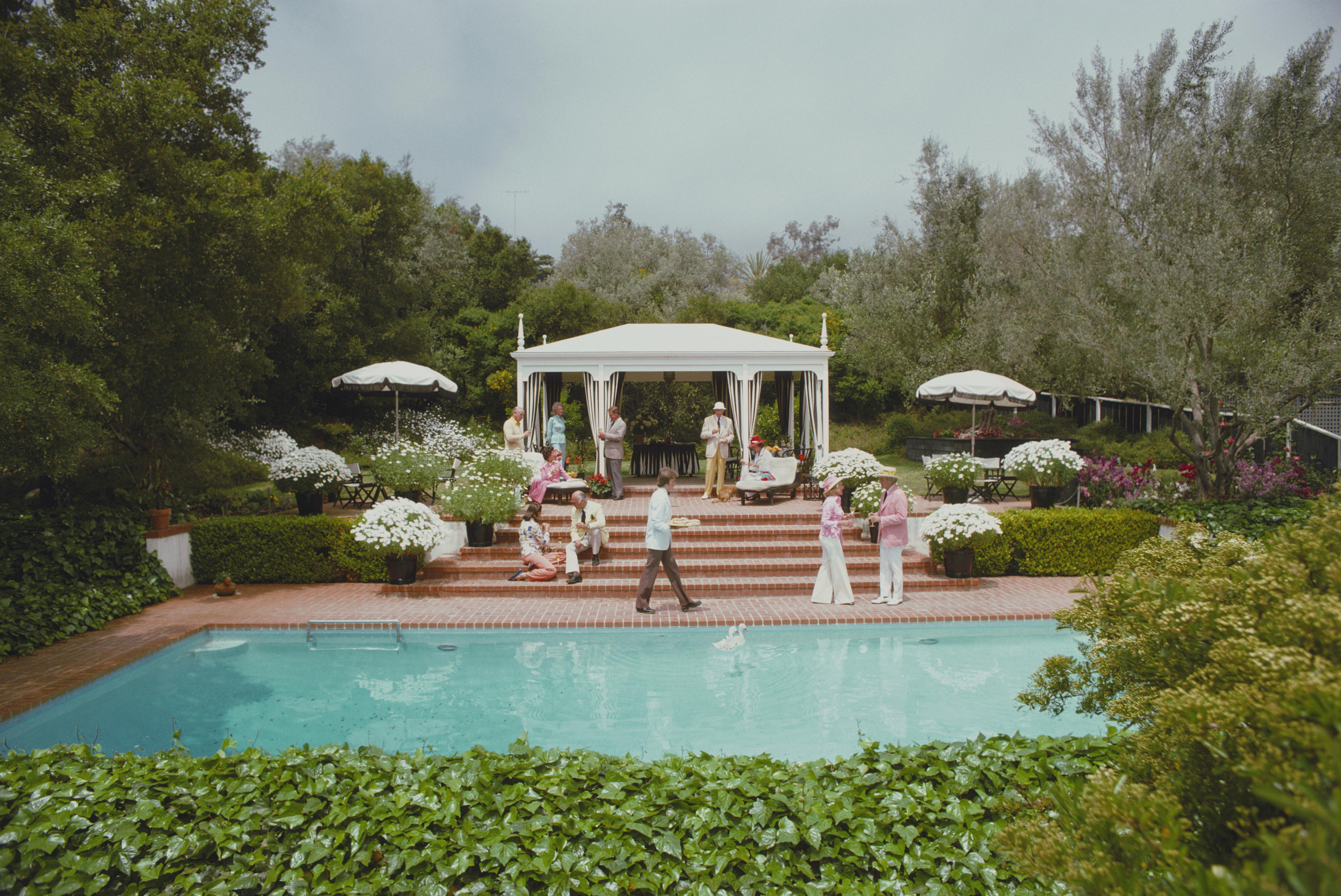 'Poolside Drinks' 1975 Slim Aarons Limited Estate Edition Print 

May 1975: Guests around the pool at Dorothy Laughlin's Santa Barbara home. (Photo by Slim Aarons/Getty Images)

Produced from the original transparency
Certificate of authenticity