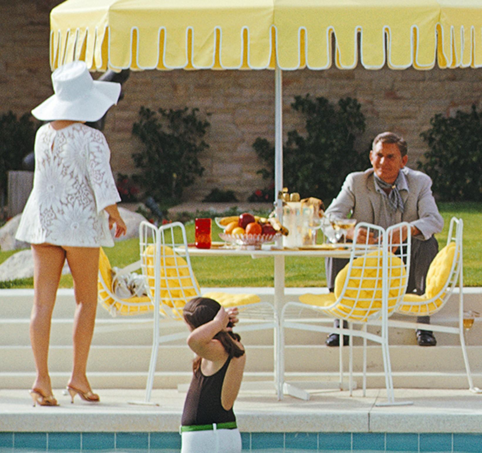 Poolside Gathering, 1970 - Poolside Gathering at Kaufmann House in Palm Springs - American Modern Photograph by Slim Aarons