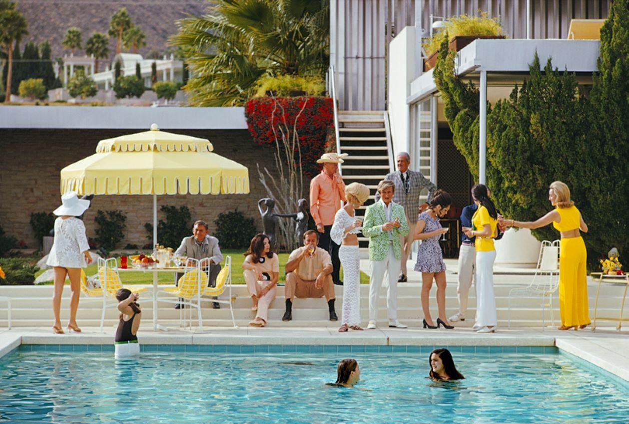 Poolside Gathering

 1970 

January 1970: The Kaufmann Desert House in Palm Springs, California, designed by Richard Neutra in 1946 for businessman Edgar J. Kaufmann

and now owned by Nelda Linsk (right, in yellow). Lita Baron and Helen Dzo Dzo are