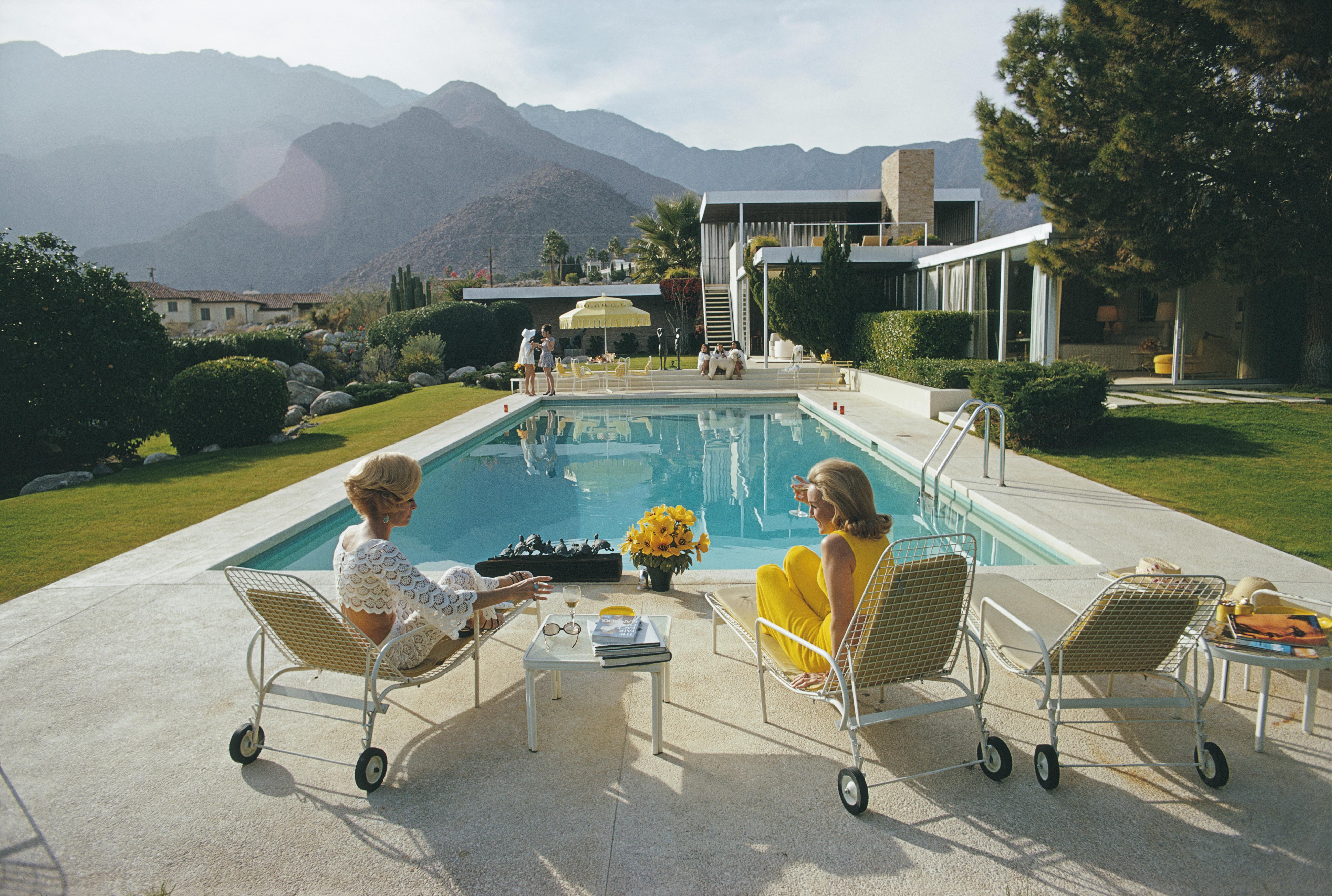 Slim Aarons Color Photograph - Poolside Pairs, Kaufmann House