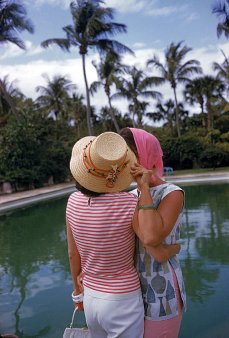 'Poolside Secrets' 1961 Slim Aarons Limited Estate Edition Print 

Flo Smith (left) and Lily Pulitzer at a pool party, Palm Beach, Florida, April 1961.

Produced from the original transparency
Certificate of authenticity supplied 
Archive