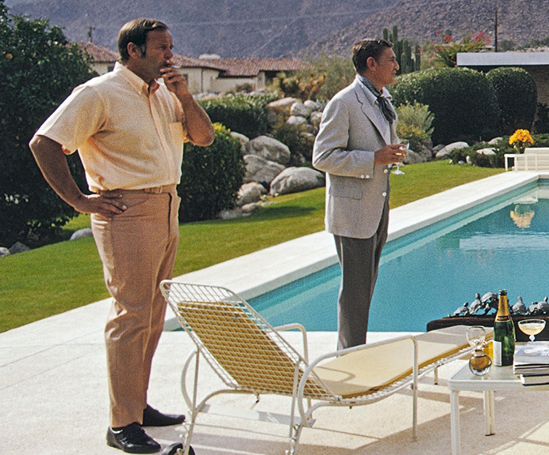 Poolside Socialites, 1970 - Poolside Glamor at Kaufmann House in Palm Springs by Slim Aarons

16