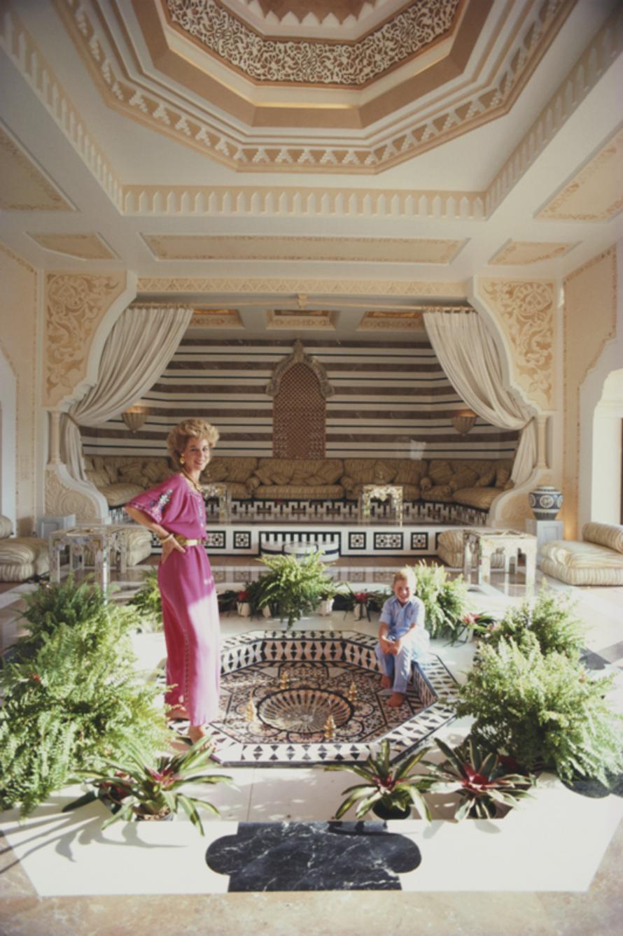 Rosemary And Khaled Said 
1982
by Slim Aarons

Slim Aarons Limited Estate Edition

Rosemary Saïd, wife of Syrian-Saudi Arabian financier Wafic Saïd, and son Khaled, relaxing at their palace-in-the-sun, Al-Khaldiah, in Las Lomas’ hills, Marbella,