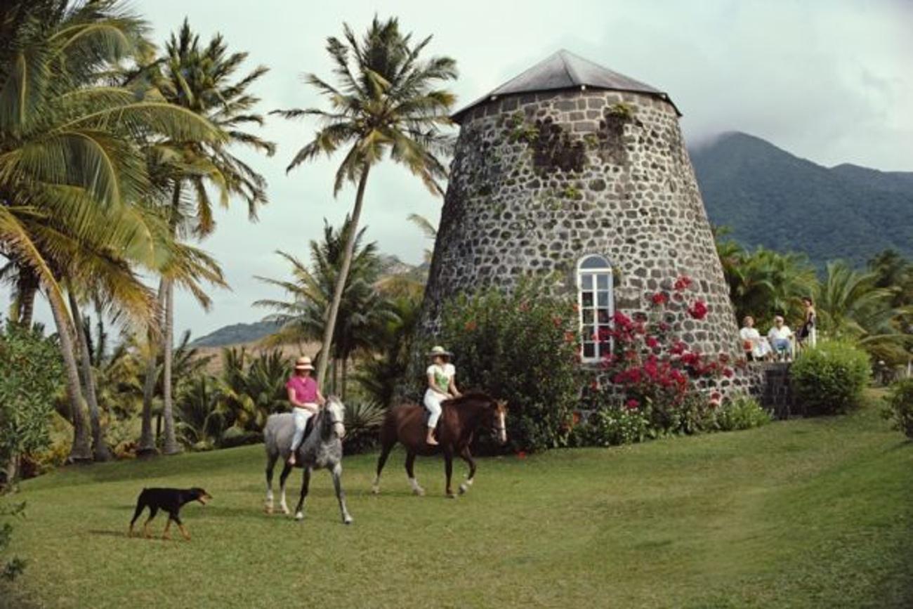 Saint Kitts and Nevis 
1984
by Slim Aarons

Slim Aarons Limited Estate Edition

Horseback riding at the Rawlins Plantation inn, Saint Kitts and Nevis, West Indies, March 1984.

unframed
c type print
printed 2023
20 x 24"  - paper size

Limited to