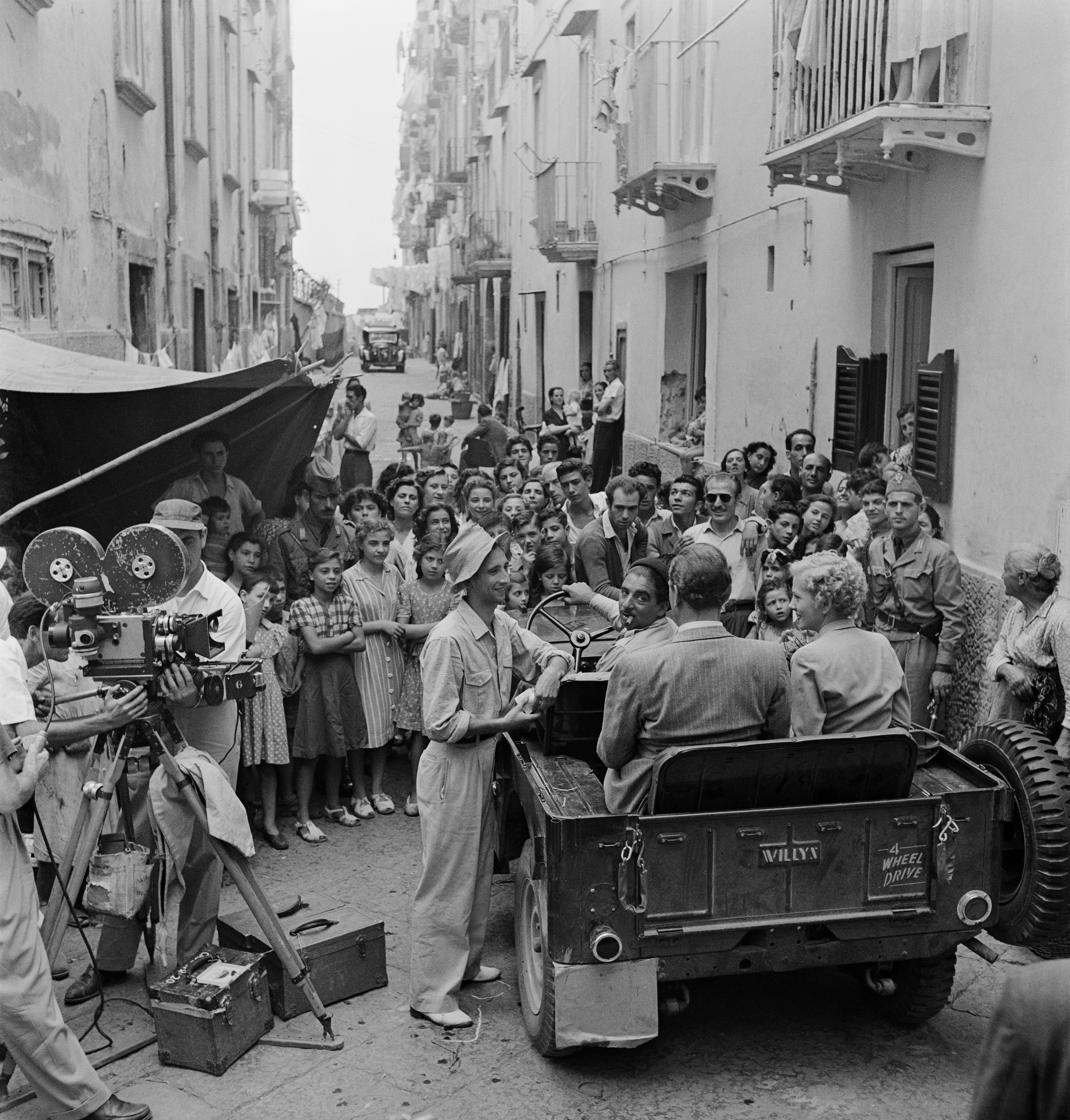 Slim Aarons Black and White Photograph - September Affair: A crowd watches Joan Fontaine and Joseph Cotten